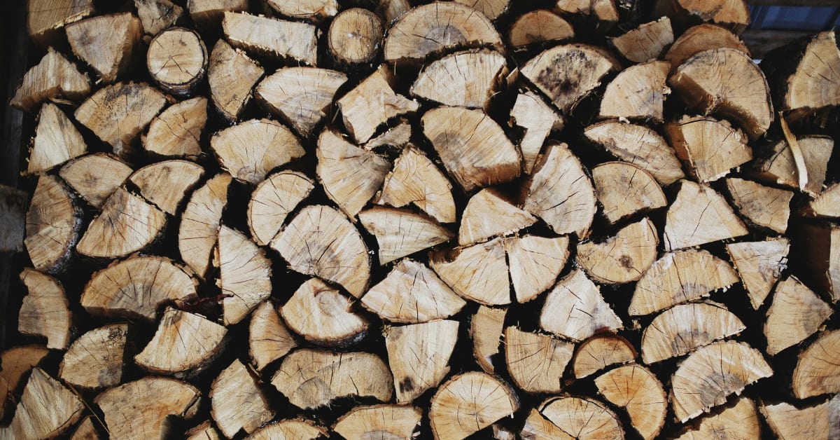 Stacked seasoned hardwood firewood ready for delivery in Evansville, IN
